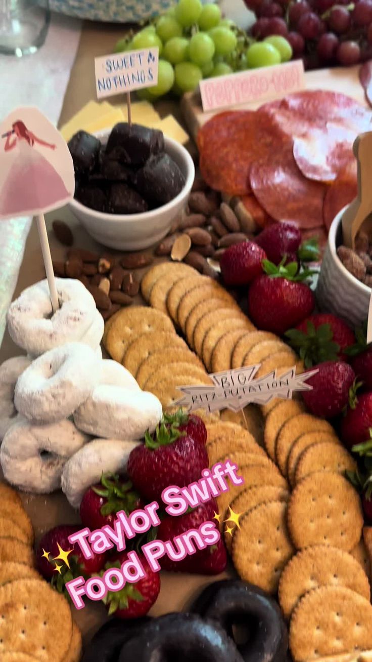 a table topped with lots of different types of food and snacks on top of it