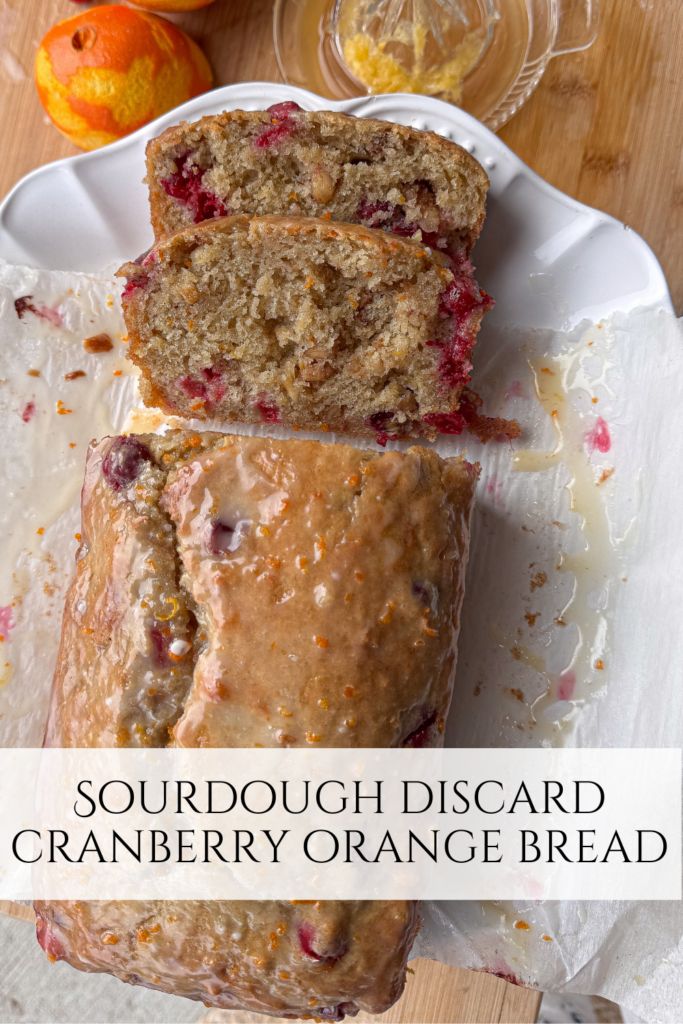 a loaf of sourdough orange bread sitting on top of a white plate next to an orange