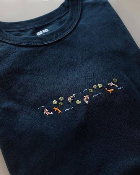 an embroidered t - shirt with horses on it