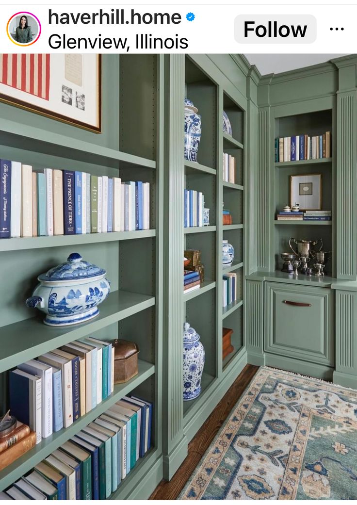 a green bookcase filled with lots of books next to a wall full of shelves