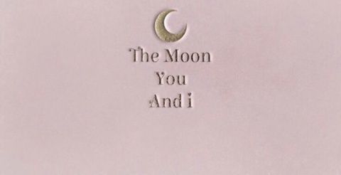 the moon you and i are written in silver on a white background with an inscription