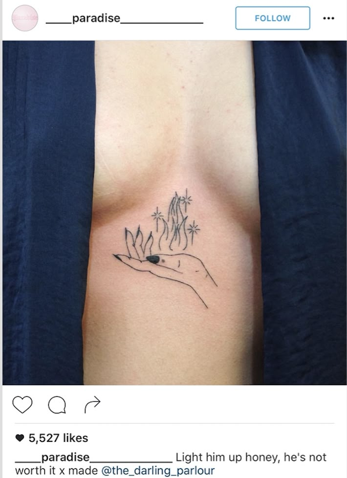 a person has a small tattoo on their chest