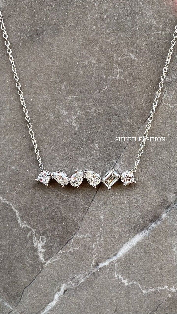 Cluster Moissanite Necklace, Multi Stone Necklace, Mix Shape Necklace Solid Gold Cluster Diamond Necklace Wedding Jewelry Anniversary Gift ✦ CENTER STONE DETAIL ✦ ✧ Stone Type : Moissanite ✧ Stone Weight :  1ct Approx ✧ Stone Clarity: VVS ✧ Luster: Excellent ✧ Make: High-Quality Craftsmanship Available Chain Lenth : 14 - 16 and 18 inches   ✦ 𝐌𝐞𝐭𝐚𝐥 𝐃𝐞𝐭𝐚𝐢𝐥𝐬 ✦ ✧ Metal Type : 925 Silver, White Gold (Another necklaces in click this link) https://www.etsy.com/in-en/shop/ShubhFashion?ref=seller-platform-&section_id=41455793 ✦✦ Customized Order ✦✦ We can also customize your dream design ring as per your preference with different cut, carat size, and clarity VVS, VS, and SI. We can also make jewelry in all-metal types like 925 Silver, 10 KT Gold, 14 KT Gold, 18 KT Gold, and also, also y Grey Moissanite Necklace, Multi Diamond Necklace, Wedding Fine Jewelry Solitaire Baguette-cut Necklace, Baguette Cut Solitaire Necklace For Wedding, Silver Solitaire Necklace With Baguette Cut For Anniversary, Silver Baguette Cut Solitaire Necklace For Anniversary, Silver Baguette-cut Diamond Necklace For Wedding, Silver Baguette Cut Diamond Necklace For Wedding, Baguette Cut Diamond White Necklace For Weddings