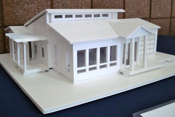 a model of a white house on top of a table