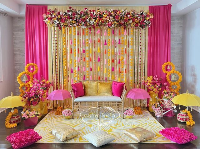 a living room decorated in pink and yellow