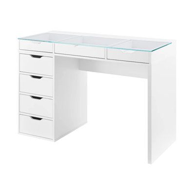 a white desk with drawers and glass top