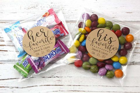 two bags filled with candy sitting on top of a wooden table