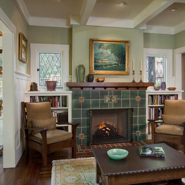 a living room filled with furniture and a fire place in the middle of a room