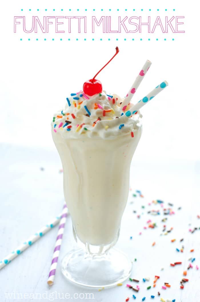 an ice cream milkshake with sprinkles and candy canes