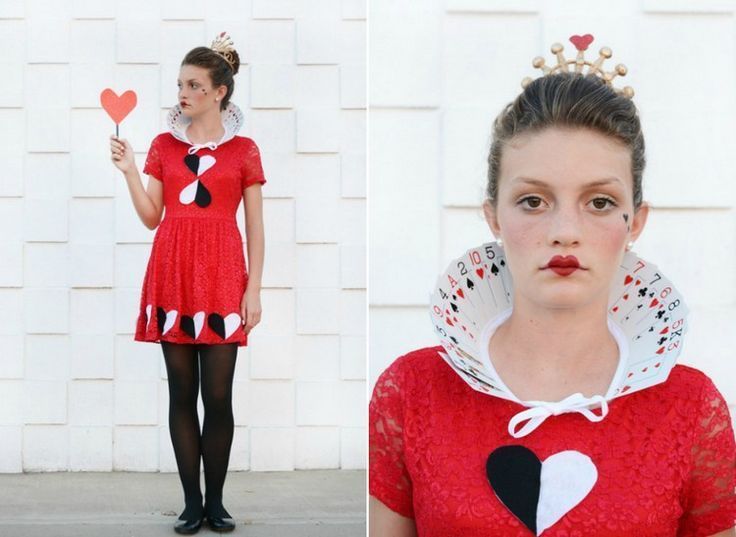 a woman wearing a red dress and holding a heart shaped lollipop in front of her face