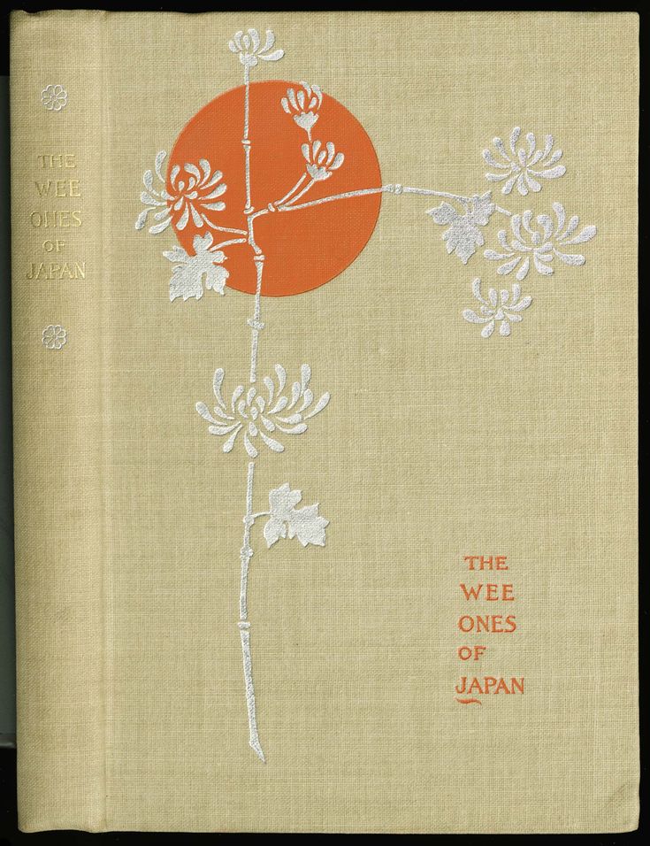 an old book with white flowers and orange circle on it's cover, the words the weee ones of japan written in japanese