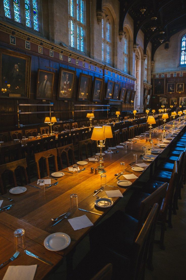 the long table is set with place settings