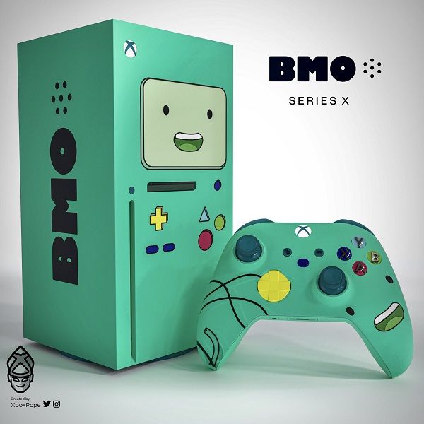 a video game controller sitting in front of a box with the words bmo on it