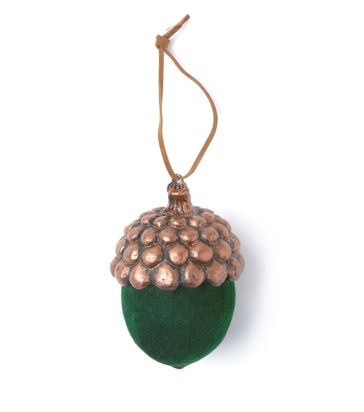 an acorn ornament hanging from a cord