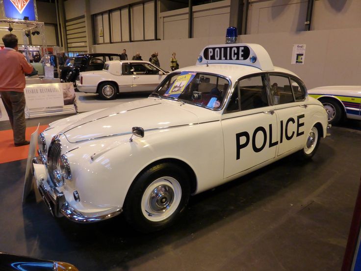 an old police car on display in a museum