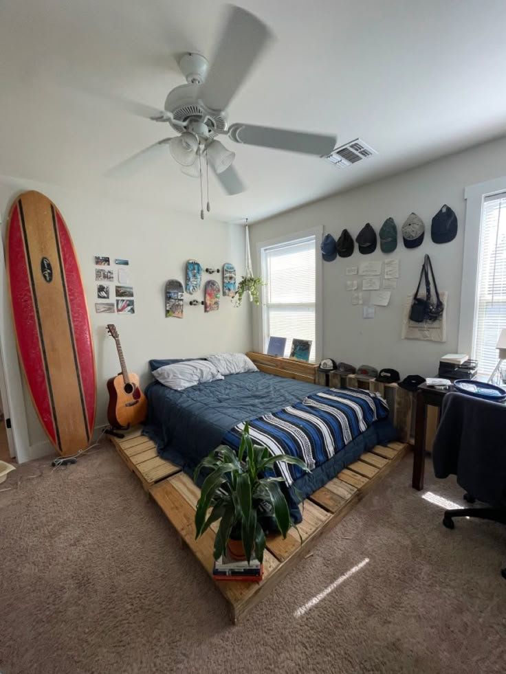 a bedroom with a surfboard on the bed