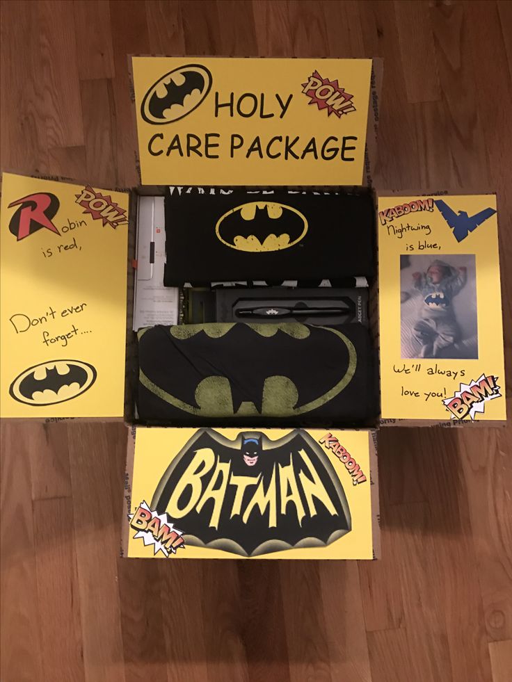 an open box with batman stickers on it