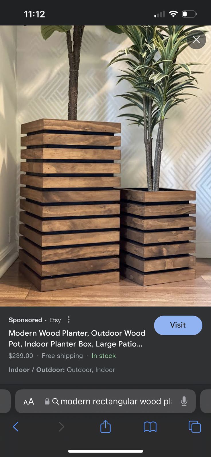 two wooden planters sitting next to each other on top of a hard wood floor