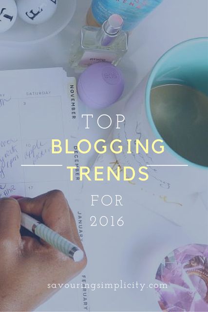 a person writing on top of a paper with the words top blogging trend for 2016