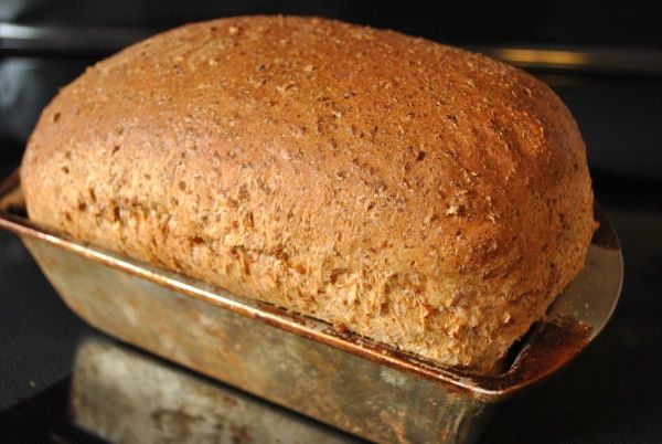 a loaf of bread sitting on top of a metal pan