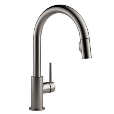 the kitchen sink faucet is stainless steel and has a pull out sprayer