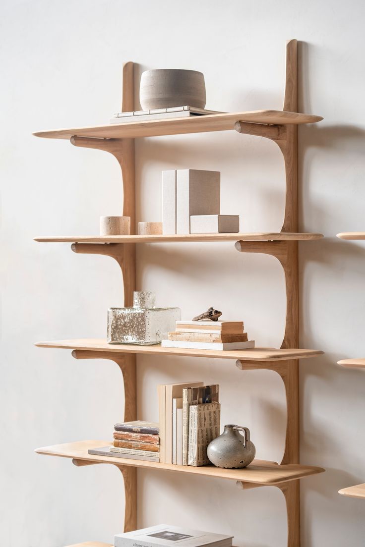 a wooden shelf with books and other items on it