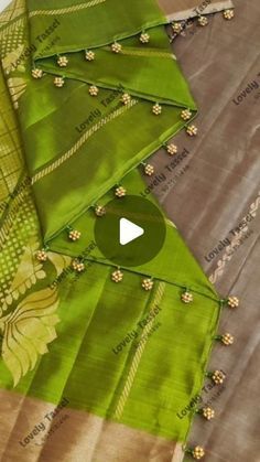 green and yellow saree with floral design on the palan silk material, which is cut