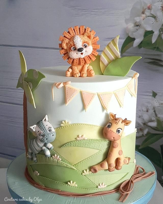 a cake decorated with an animal and giraffe