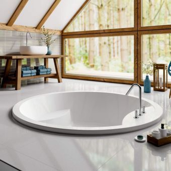 a large white bath tub sitting inside of a bathroom next to a wooden table and chairs