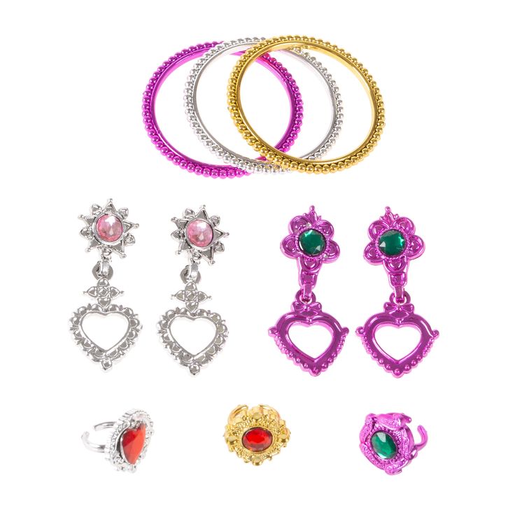 several pairs of earrings are shown on a white background