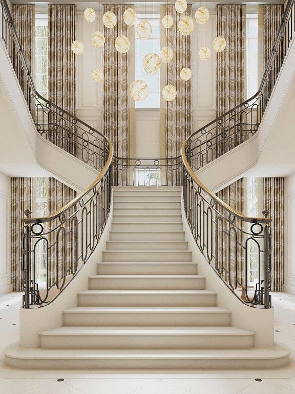 an elegant staircase with chandeliers and curtains