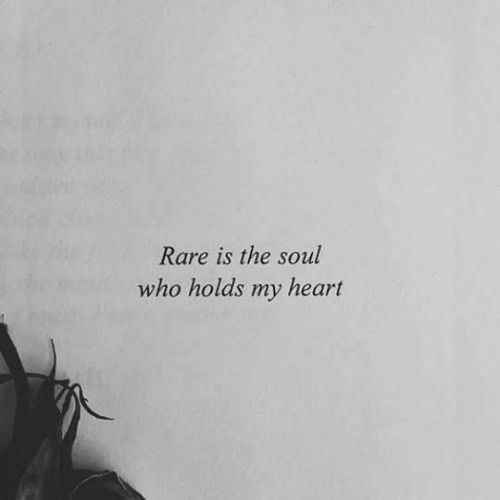 a black and white photo with the words rare is the soul who holds my heart