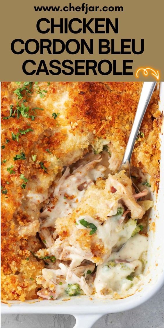 chicken cordon bleu casserole in a white dish with a spoon