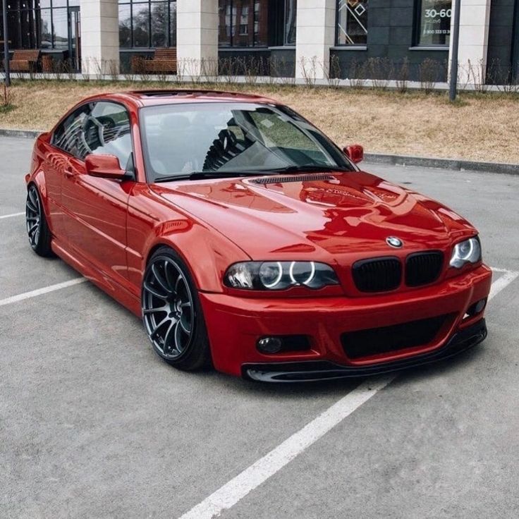 a red car parked in a parking lot