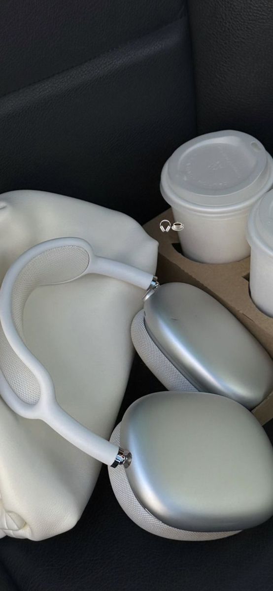 there are several items in the back seat of a car, including cups and saucers