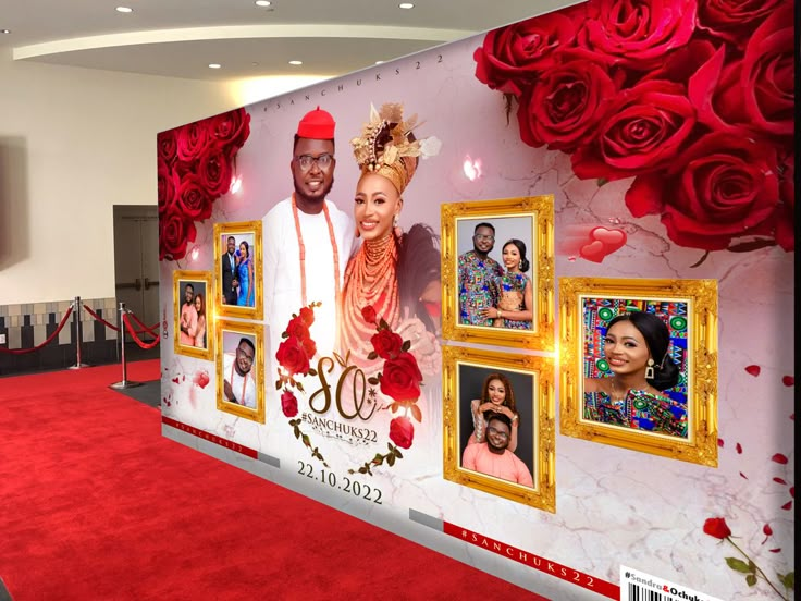 a large red carpeted room with pictures on the wall and flowers in the background