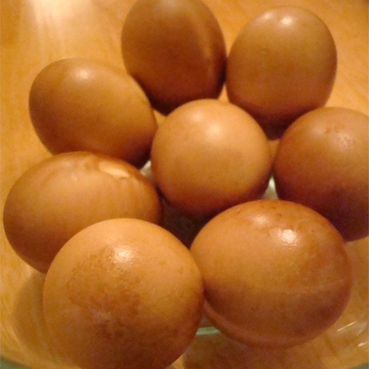 a glass bowl filled with lots of brown balls