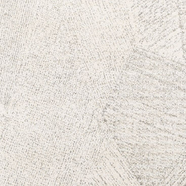 a white rug with small dots and lines on the floor, as if it were made from carpeting material