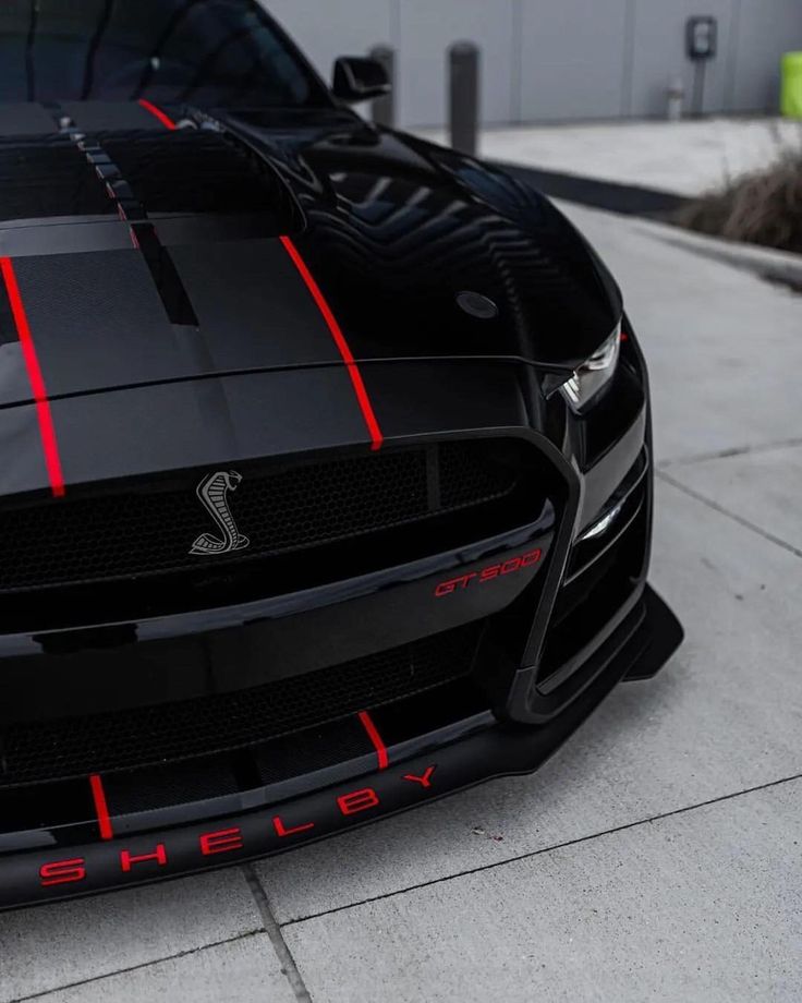 the front end of a black sports car