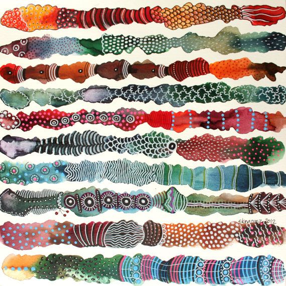 an assortment of different colored fish on white paper