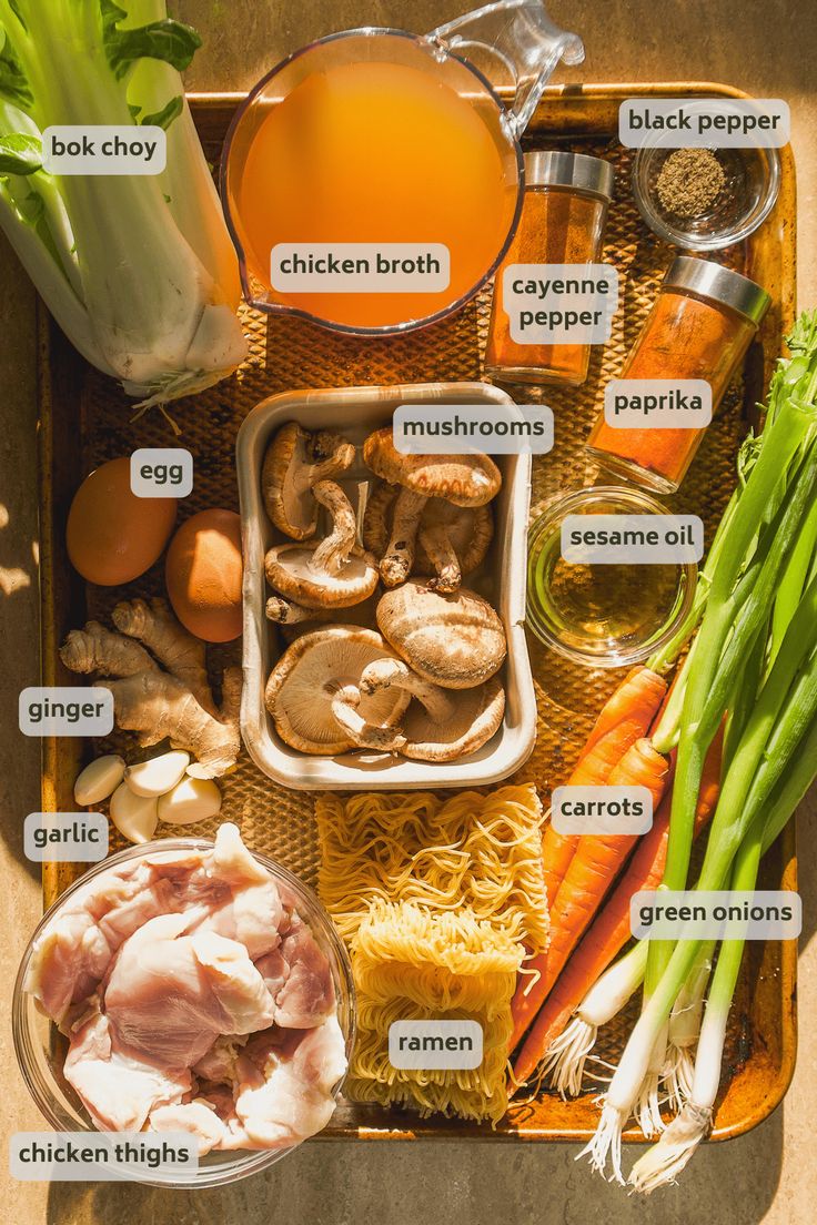 an overhead view of food including carrots, broccoli, mushrooms and other ingredients