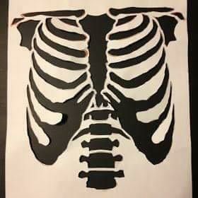 an image of a skeleton cut out from paper