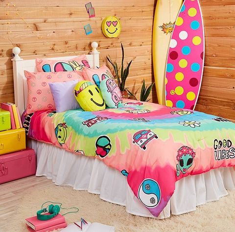 a bed room with a surfboard on the wall and other items in front of it