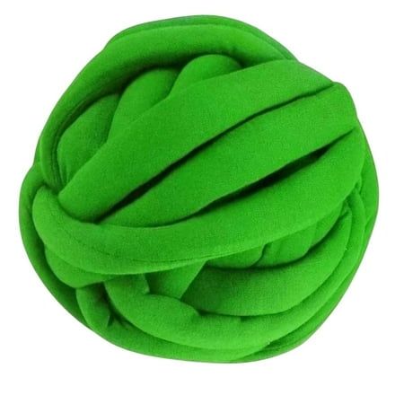 a ball of green fabric on a white background