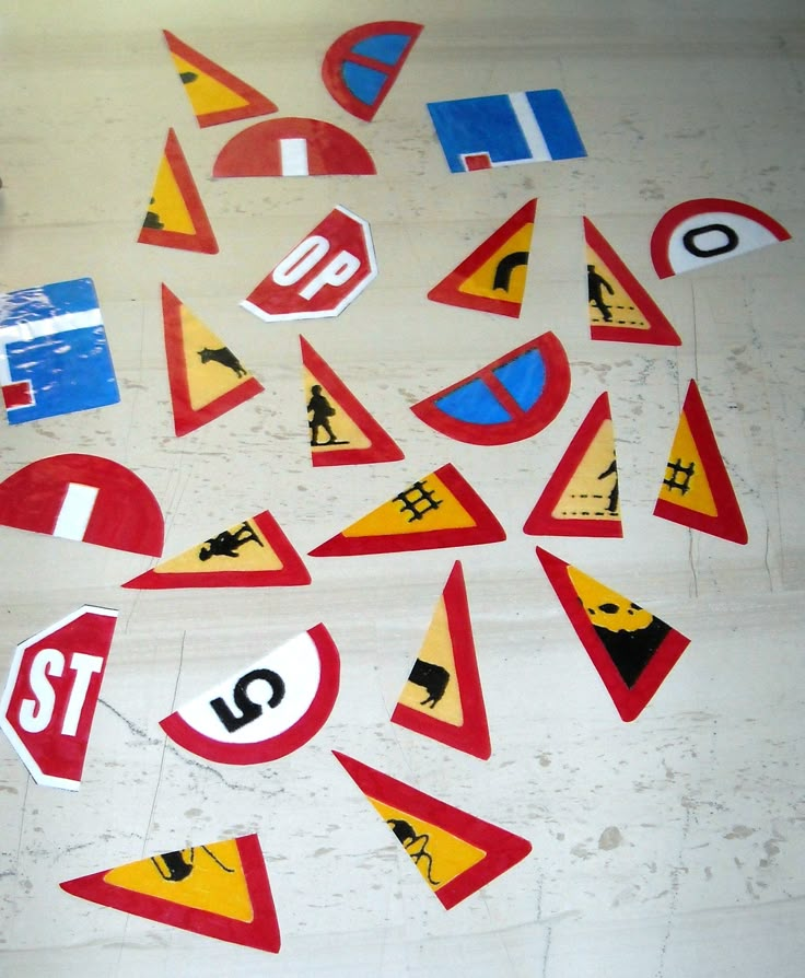 various traffic signs are arranged on the floor