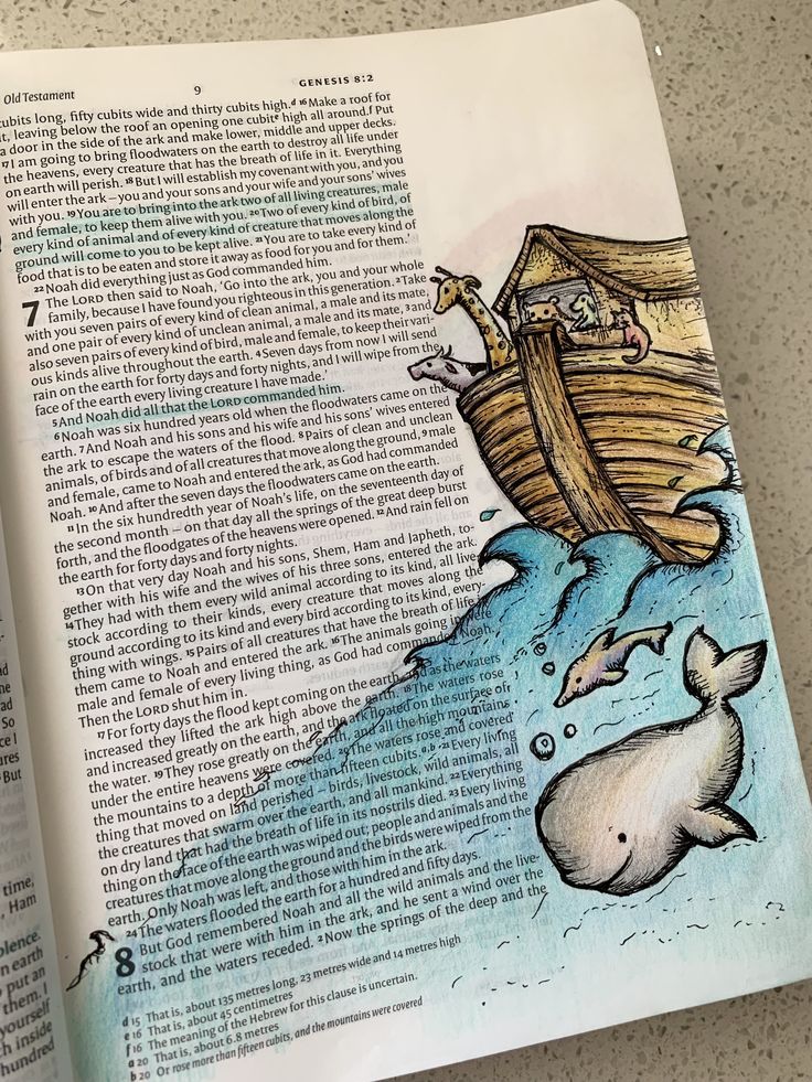 an open book with a drawing of a whale and a man in a boat