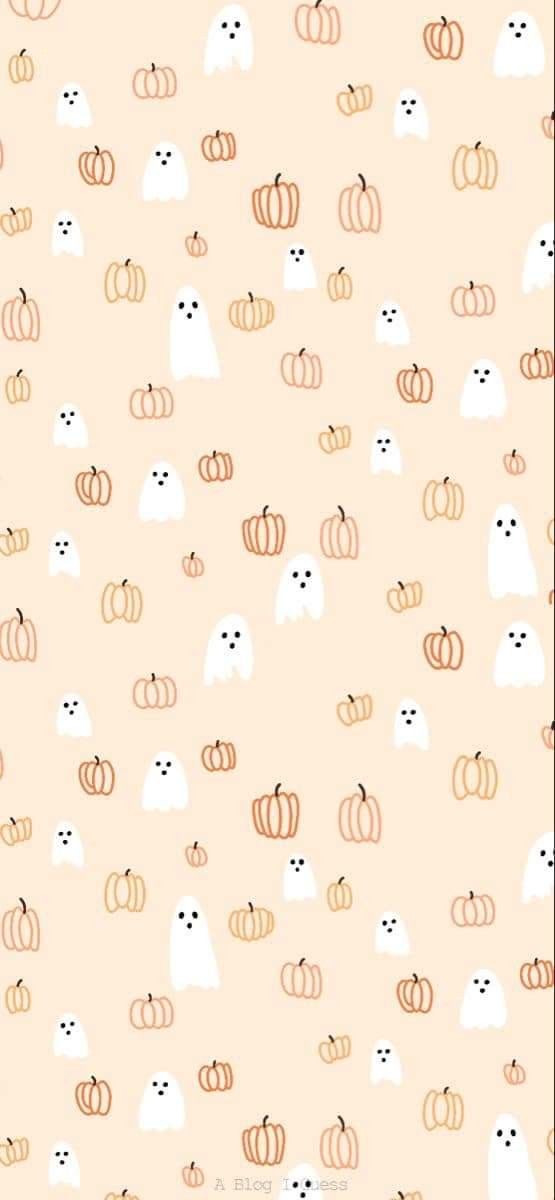 an orange and white wallpaper with cats, pumpkins and ghost faces on it