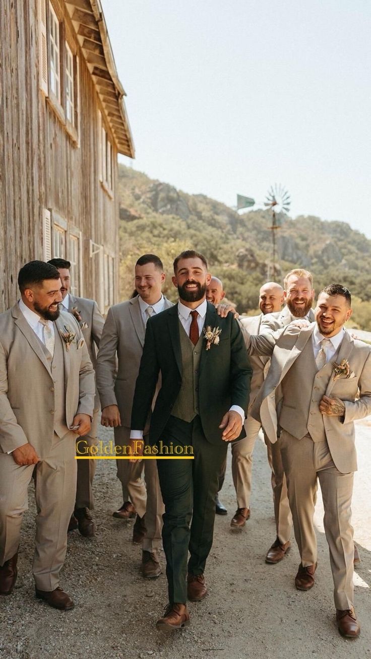 a group of men standing next to each other in front of a wooden building wearing suits and ties