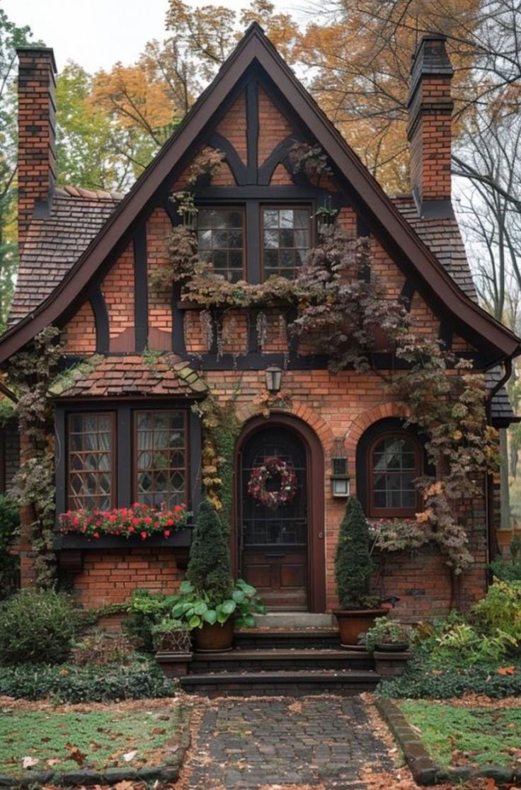 a brick house with ivy growing on it's windows