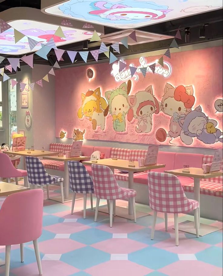 the interior of a restaurant decorated in pink and white checkered chairs, with cartoon characters on the wall